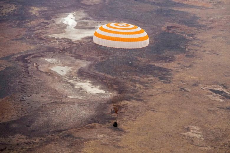 The Soyuz MS-16 capsule, carrying the International Space Station crew members Christopher Cassidy of NASA, Anatoly Ivanishin and Ivan Vagner of the Russian space agency Roscosmos, descends beneath a parachute just before landing in a remote area outside Zhezkazgan, Kazakhstan. GCTC/Roscosmos